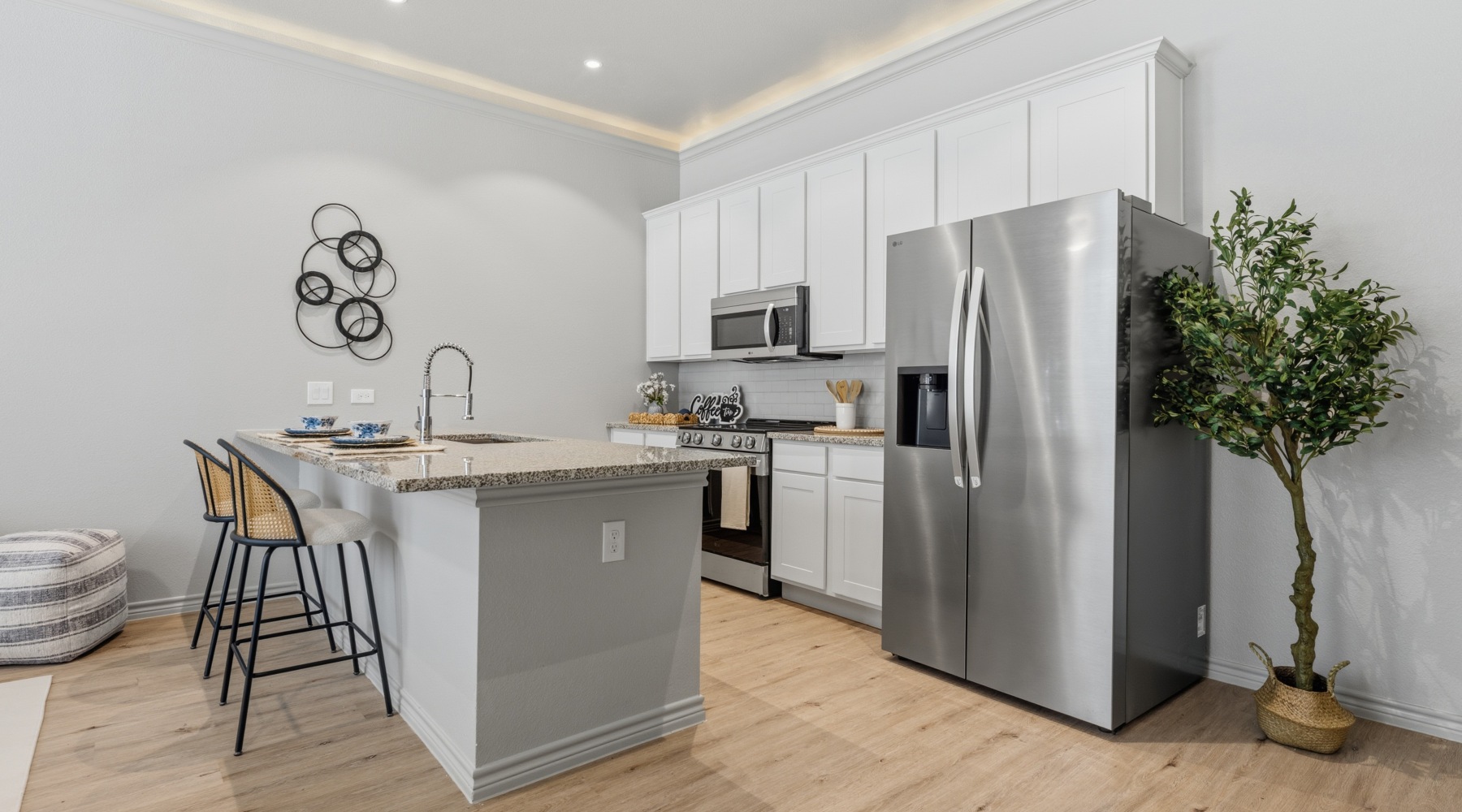a kitchen with white cabinets