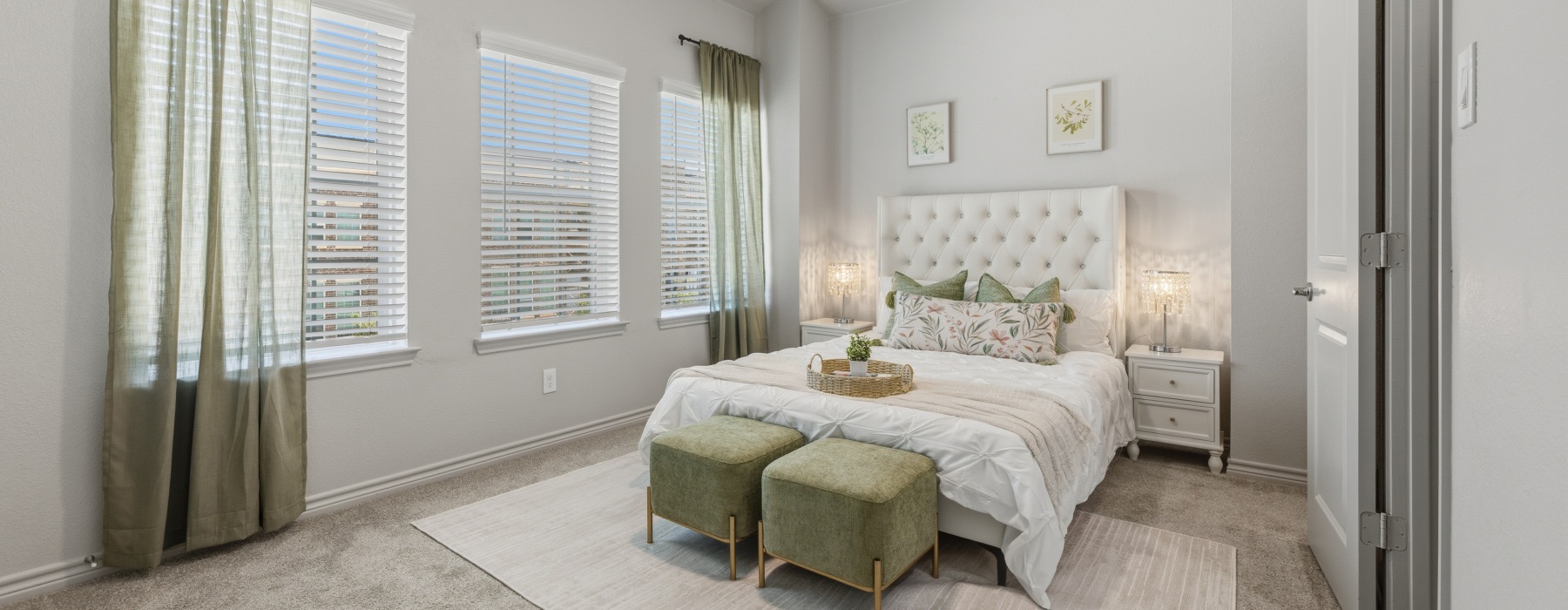 a bedroom with a bed and a fan