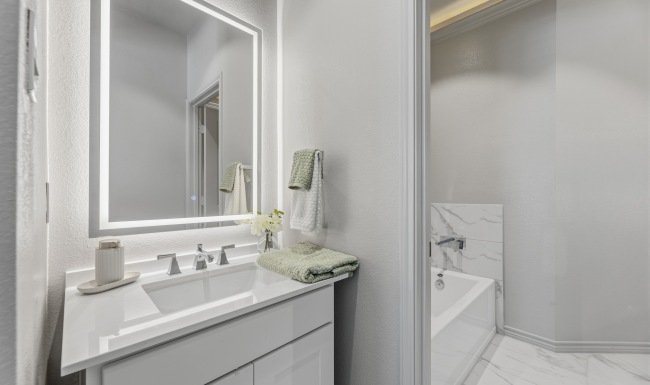 a bathroom with a tub and a shower