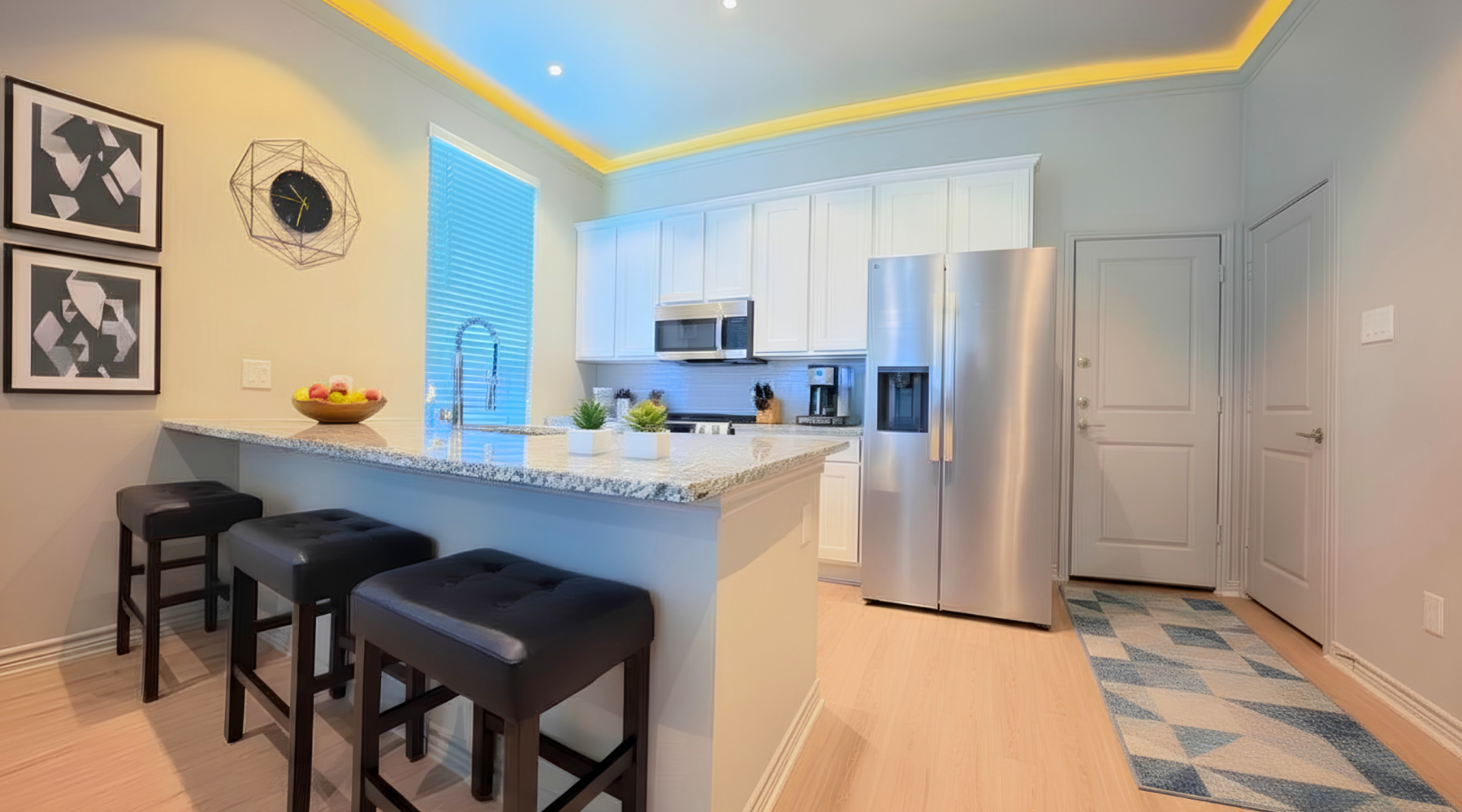 a kitchen with white cabinets