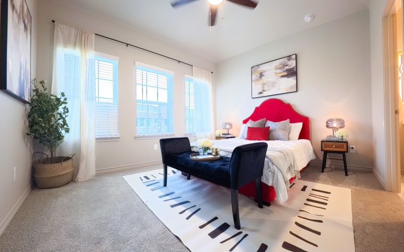 a bedroom with a bed and a chair